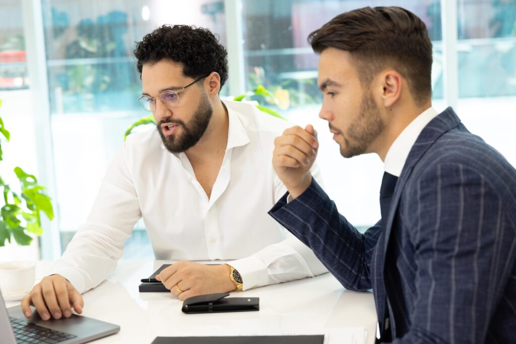 Men in the office talking. 